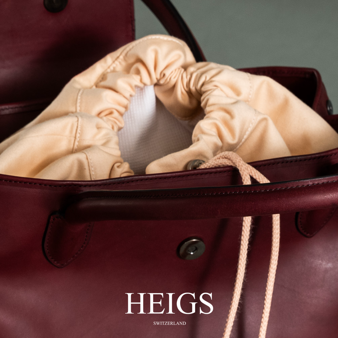 ''...EN SUISSE'' IN BURGUNDY RED